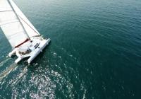 trimaran sailing crew on deck